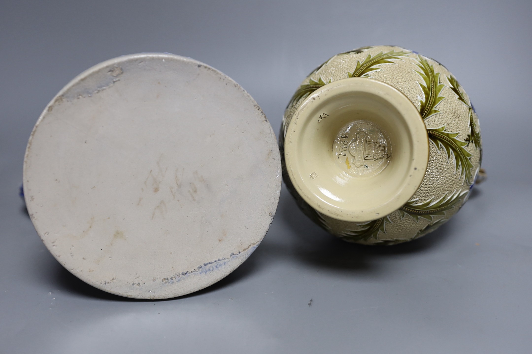 A Mettlach stoneware stein, 29.5 cm high, a German blue stoneware stein, a Staffordshire porcelain cottage pastille burner and an English porcelain floral plate